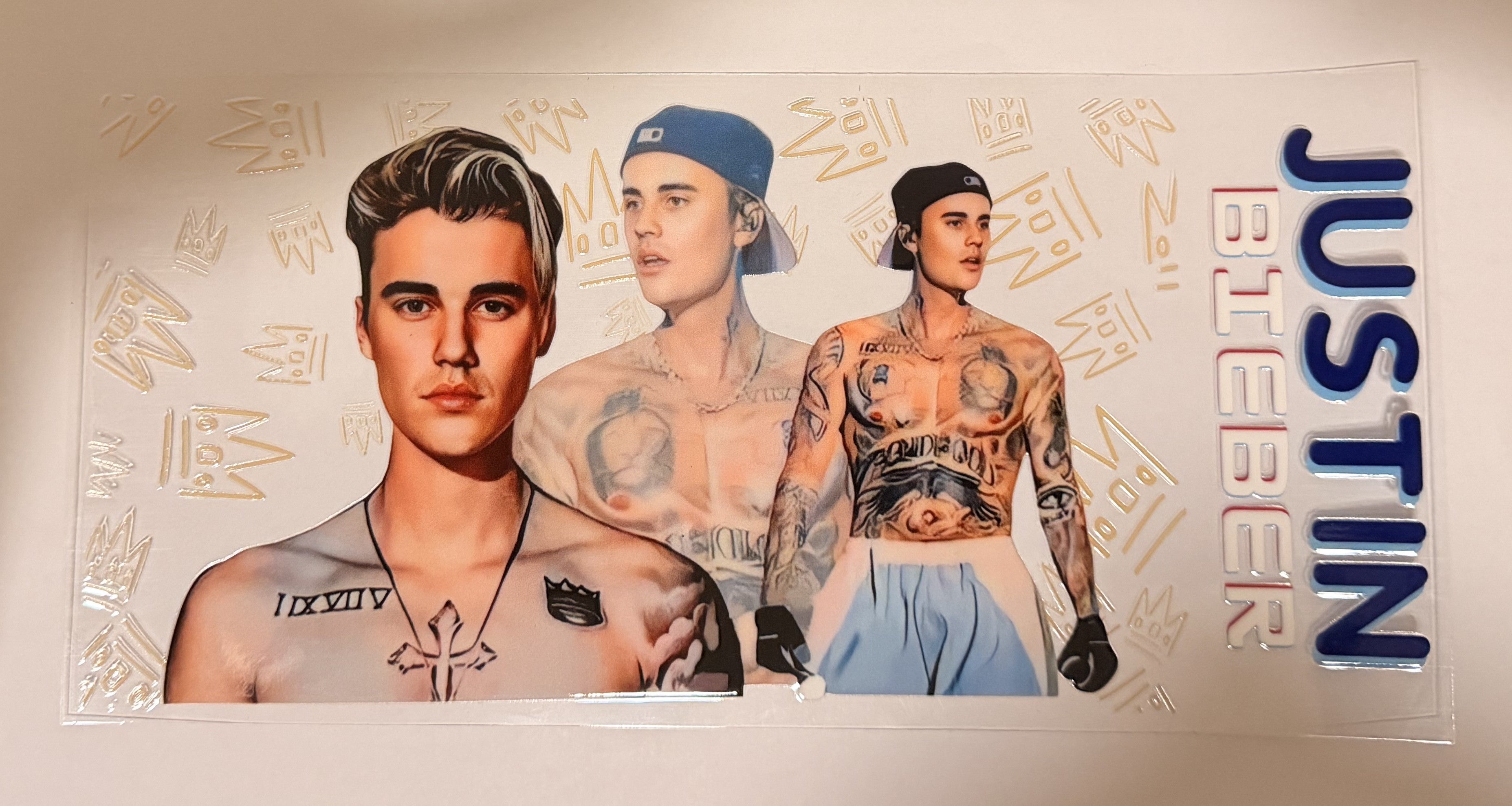 A custom acrylic standee featuring illustrated and photographed images of Justin Bieber, with 'JUSTIN BIEBER' printed vertically on the right side, set against a light background.