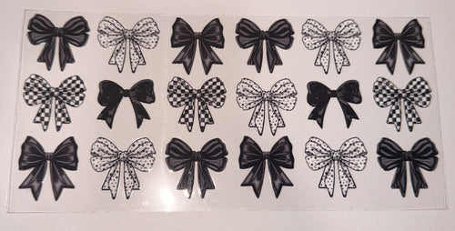 A sheet of clear nail wraps or decals featuring 16 different bow designs in black and white patterns, including solid black, checkered, and polka dot bows, displayed on a white background.