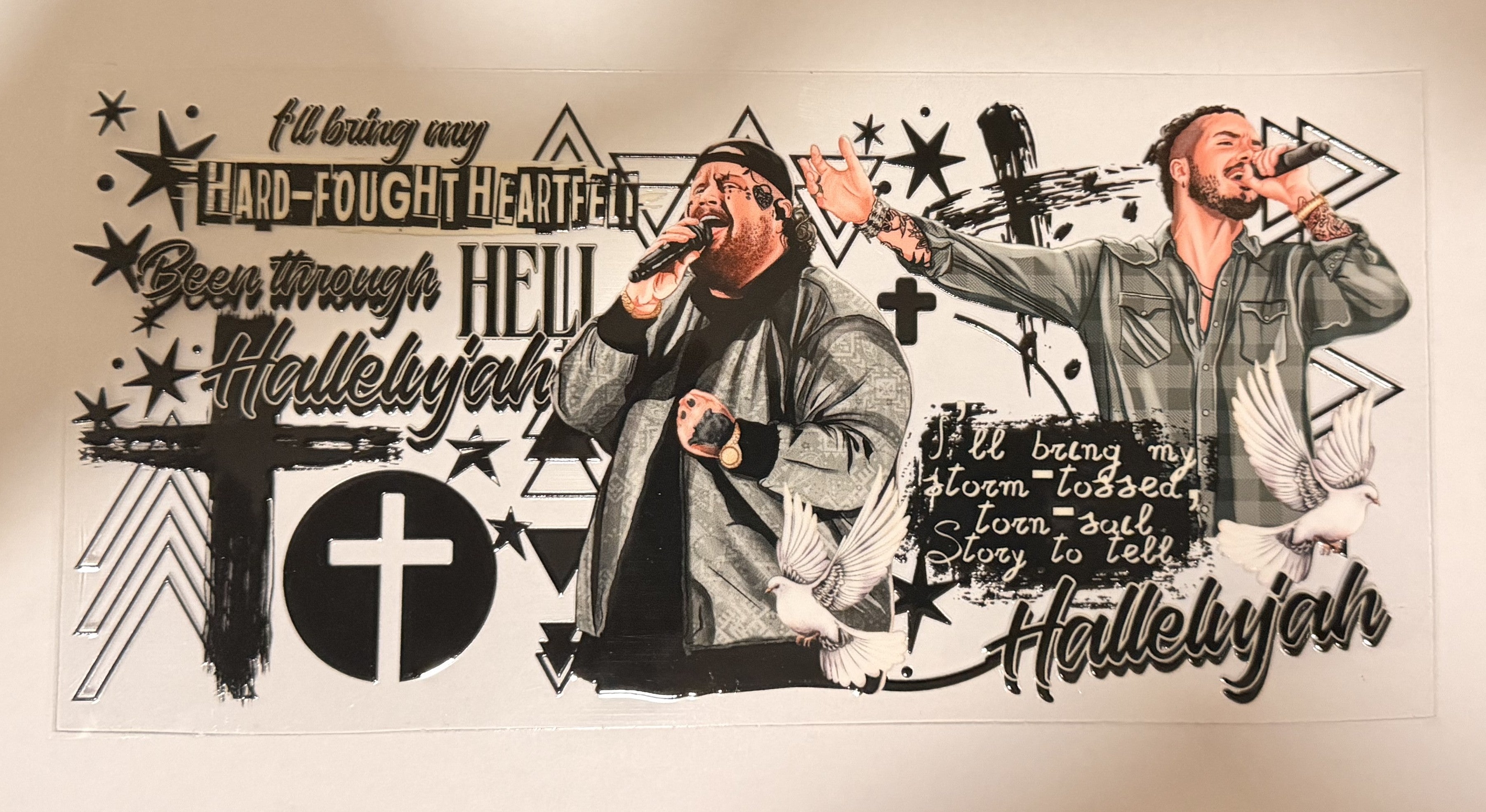 A black and white graphic print featuring two men holding microphones, surrounded by bold text, stars, crosses, and geometric shapes on a light background.